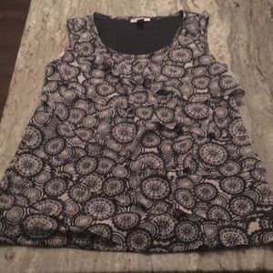 Short sleeved top with ruffled front.